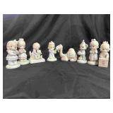 8 Precious Moment Figurines.