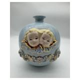 Ceramic Vase With Baby Face Design.