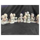 11 Precious Moment Figurines.