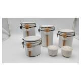 4 Stoneware Canisters With Spoons