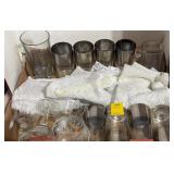 Wine glasses, drinking glasses, doilies