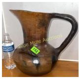 Pottery pitcher been repaired