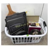 Laundry basket w/cutting boards, cookie sheets,