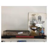 Items on Shelf- Box, Fluid Lamp, Print, Etc.