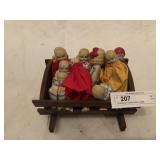 12 Miniature Porcelain Dolls In Cradle