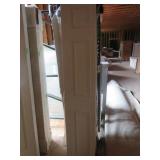 (2) Six Panel Masonite Bi-Fold Closet Doors