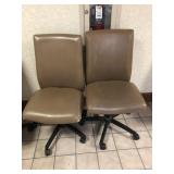 2 Tan Upholstered Adjustable Office Chairs