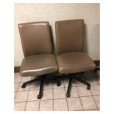 2 Tan Upholstered Adjustable Office Chairs