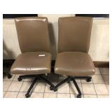 2 Tan Upholstered Adjustable Office Chairs