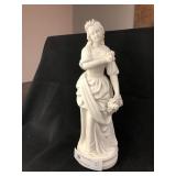 Bisque Figurine Holding Flower Bouquet