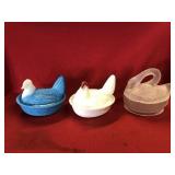 Two Hen on Nest and a Swan on Nest