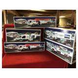 Four Hess Advertising Trucks and One Empty Box