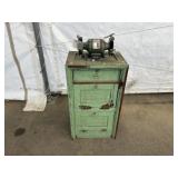 Bench Grinder on Primitive Wooden Cabinet