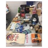 Table of Soda Bottles, Advertising, Crates, Etc.