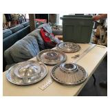 Assorted wheel covers and Chrysler emblem w/ tote