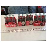 Assorted coke bottles