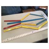 Assorted advertising measuring sticks some