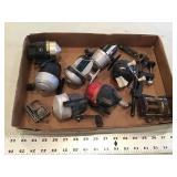 Assorted fishing reels and scale