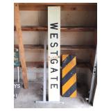 Metal Westgate and caution signs