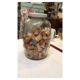 Wooden spools and jar