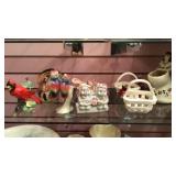 Shelf of planters, figurines and candle holders