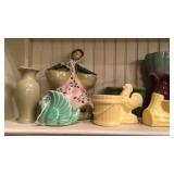 Shelf of planters and vases