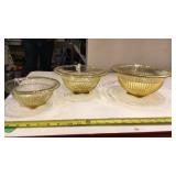 Nest of 3 amber depression bowls