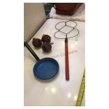 Rug beater, bells, enamelware pan