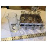 Wind up in traer pitcher and glasses