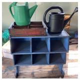 Blue Shelf Unit, Pepsi cart and 2 watering cans