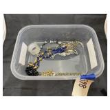 Plastic bin w/necklaces