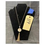 Gold Toned Necklace on Display