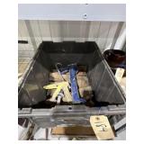 Wood Pieces & Caulk Guns in Plastic Bin