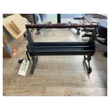 Vintage Cast Iron Newspaper Log Roller