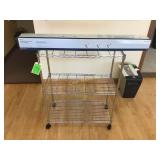 Wire rack on wheels and one section of three Wire rack on wheels and one section of three