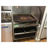 36 inch char grill on wheels.  Gas fired, has
