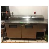 True 67 inch refrigerated pizza prep unit.