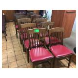 10 Wood chairs with padded seats that are
