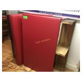 Two 54  inch wide red vinyl covered seats