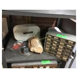 Nut in bolt bin and toilet paper dispenser in