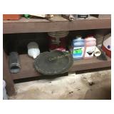 Lower shelf of cleaners and wire
