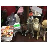 Lot of assorted juicers and food processing parts