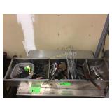 Large bin of kitchen utensils