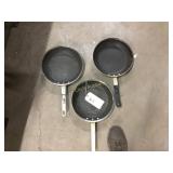 Three frying pans