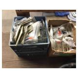 Two bins of assorted switch plate covers