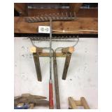 Two metal rakes