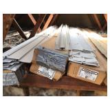 Three boxes of siding parts and more