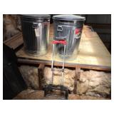 Two metal garbage cans and the Magna Cart