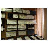 Display cards of assorted jewelry on wall