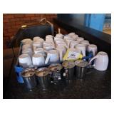Lot of coffee mugs and creamers